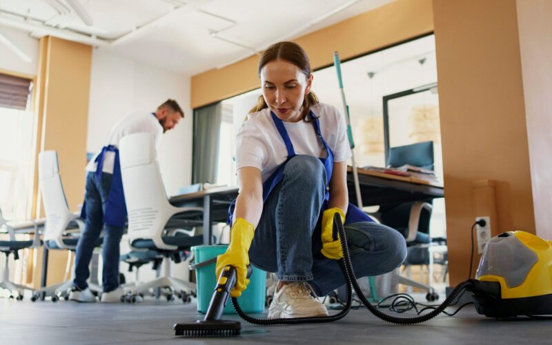 female cleaning the workplace carpet